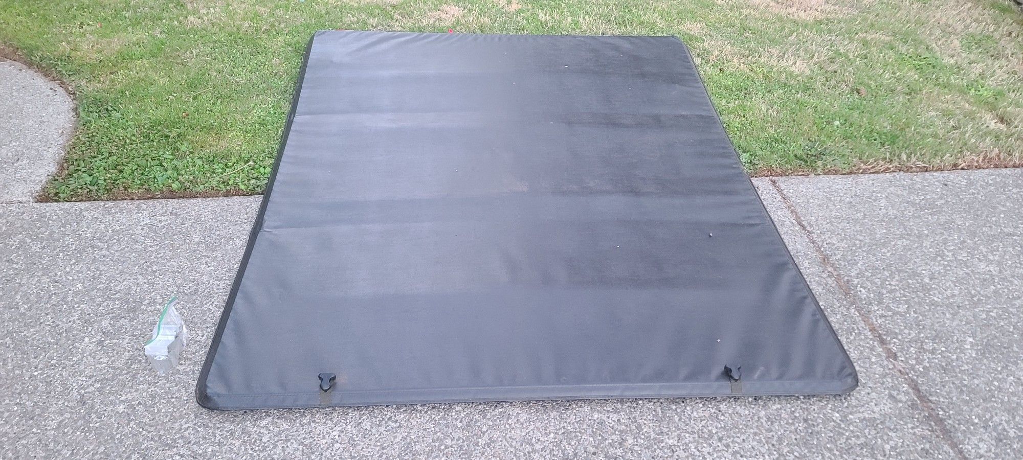 American Tonneau 66502 Soft Tri-fold Tonneau Cover - fits Frontier 2005-18 (6 ft Bed)