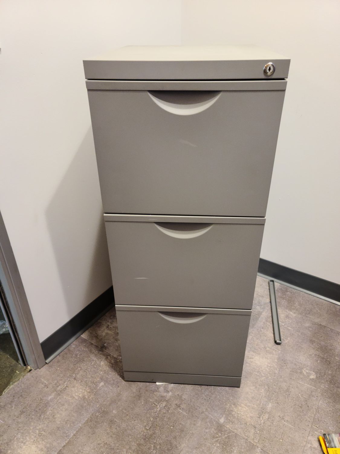 File cabinet with key lock - gray metal