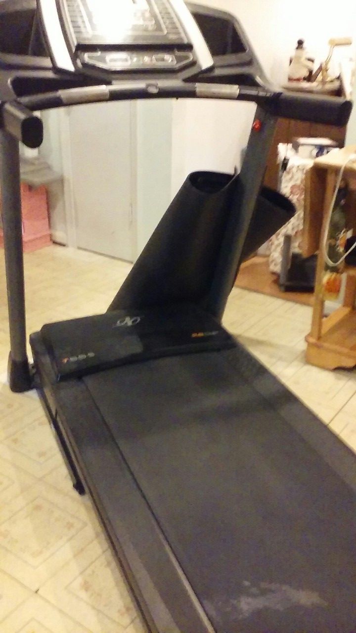 Treadmill with pad , hardly been used, asking $350.00 obo it folds , it is a NordicTrack