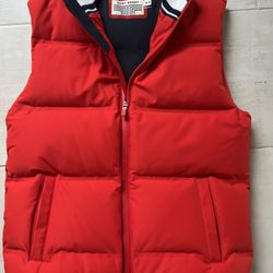 Tory Burch (Tory Sport) Red nylon and duck down puffer vest.  Zips up and has hand pockets, adjustable at bottom and navy blue interior.  New- with ou