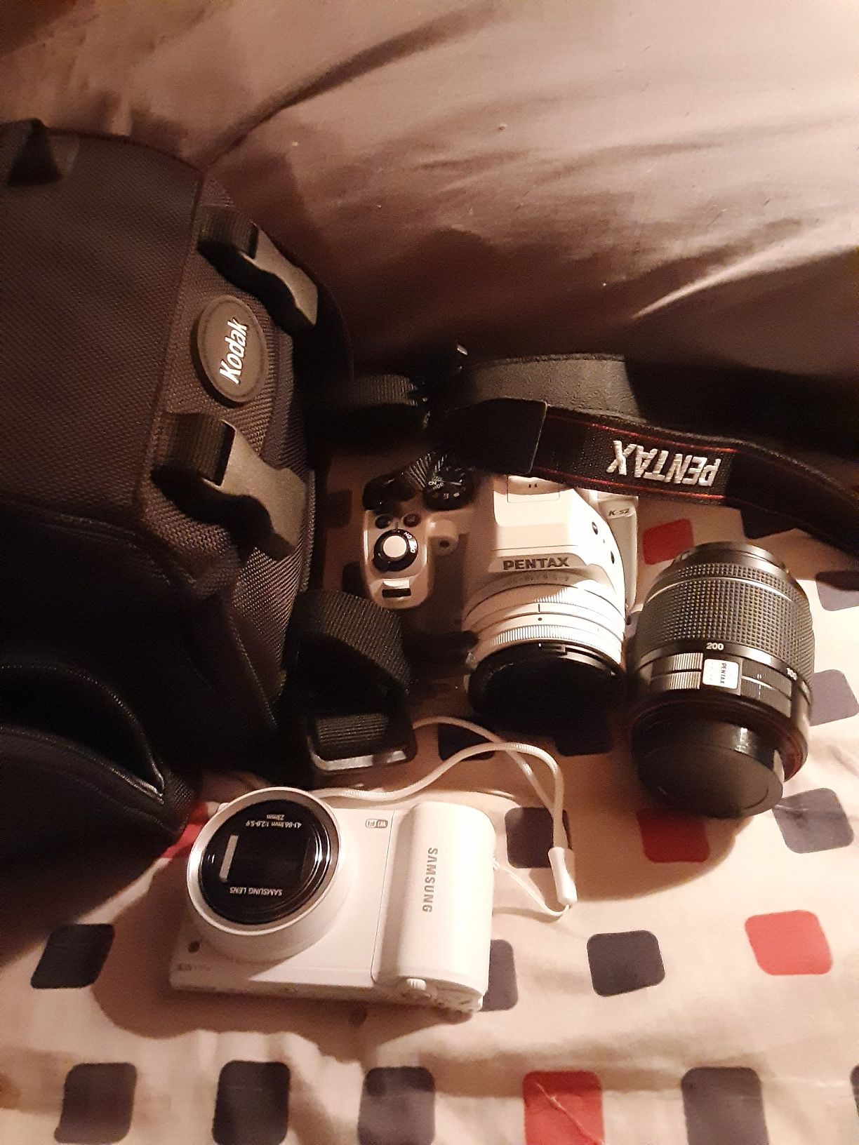 Pentax and Samsung cameras with bag