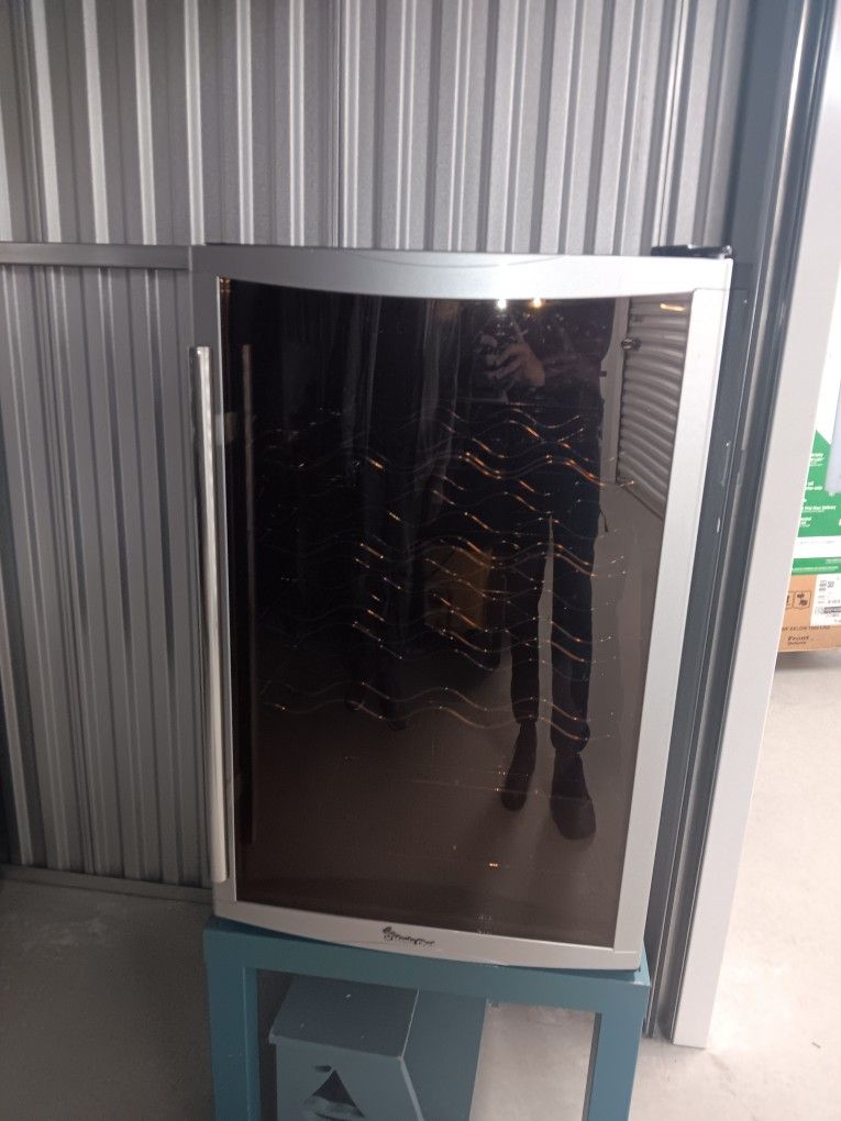 Whynter Wine Cooler / Beverage Fridge stylish stainless steel design with tinted glass door and chrome racks.