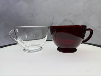(2) Anchor Hocking Royal Ruby Red & Clear glass footed teacups, often utilized for serving punch.These vintage cups feature a deep red hue and a clear