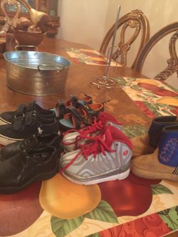 Black ostrich shoes size 2 real nice $15 , red and grey shoes size 5 $7,jake sandals size 5 $7,polo shoes size 5 $7,little brown boots size 4 $5