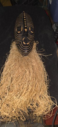 Northern Water Spirit" mask, handcrafted from sese wood and raffia in Ghana, West Africa.