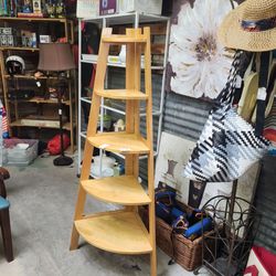 Corner unit open shelving unit pine color. Indoor plants or bookshelf