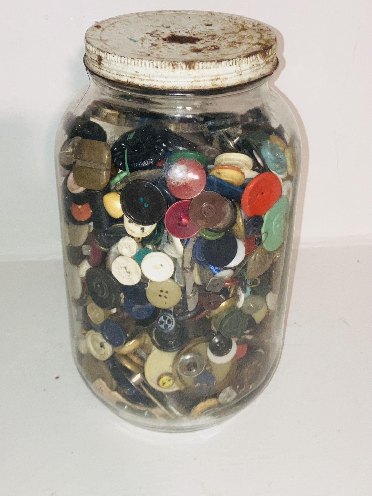 Huge gallon glass, vintage jar, full of vintage buttons and other sewing materials.