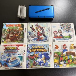 Nintendo 3DS XL with 7 games.