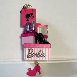 This Barbie 2011 Hallmark Keepsake Christmas Ornament is a must-have for any Barbie collector or enthusiast. It features a spotlight on shoes, showcas
