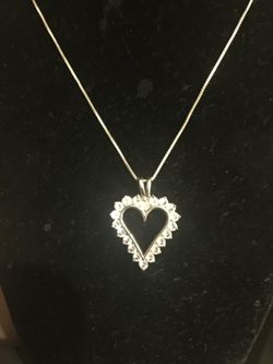 925 Sterling silver necklace with zirconia heart charm.. 18" inches $15
