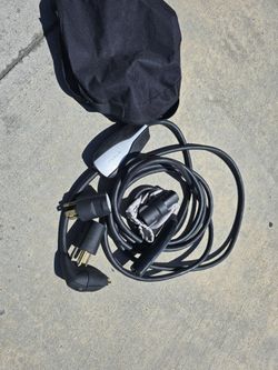 Tesla Home Charger With All The Voltage Adapters And A E-charging Adapter For Non Tesla Chargers