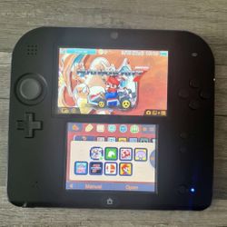 Nintendo 2ds in black (Comes with “games” )