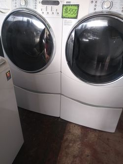 Kenmore front load washer and dryer set with pedestals in excellent conditions
