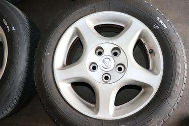 2 16" INCH WHEELS WITH NEW TIRES 1 IS A GS300 WHEEL