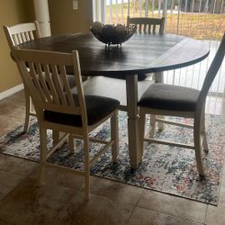Wooden table with its 4 chairs