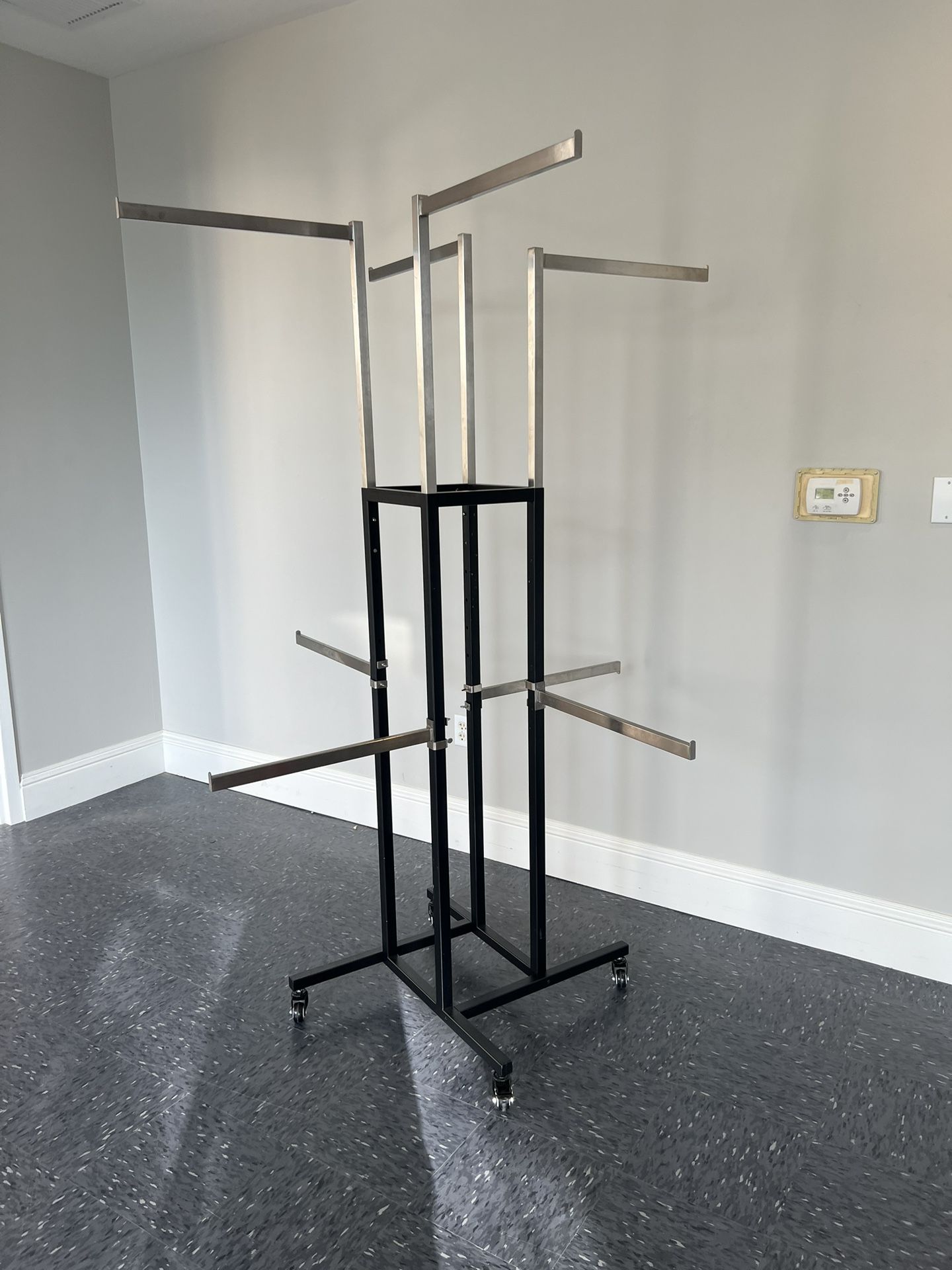Clothing Display Rack with 8 Adjustable Arms for Sale in Boynton Beach