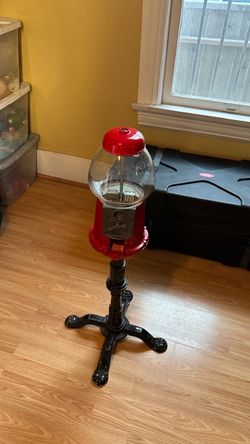 Red Gumball Machine on Cast Iron Stand