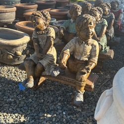 Little Boy And Girl Statues