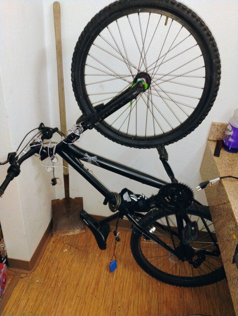 Mountain Bike With Headlights On It And Tail Light Strips