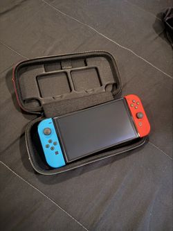 LIKE NEW Nintendo Switch OLED with Case