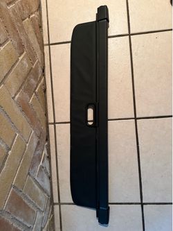 black retractable rear trunk cargo cover