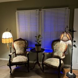 2- Antique High Back Arm Chairs, 2 Antique Floor Lamps, 1- Round Wood Table 