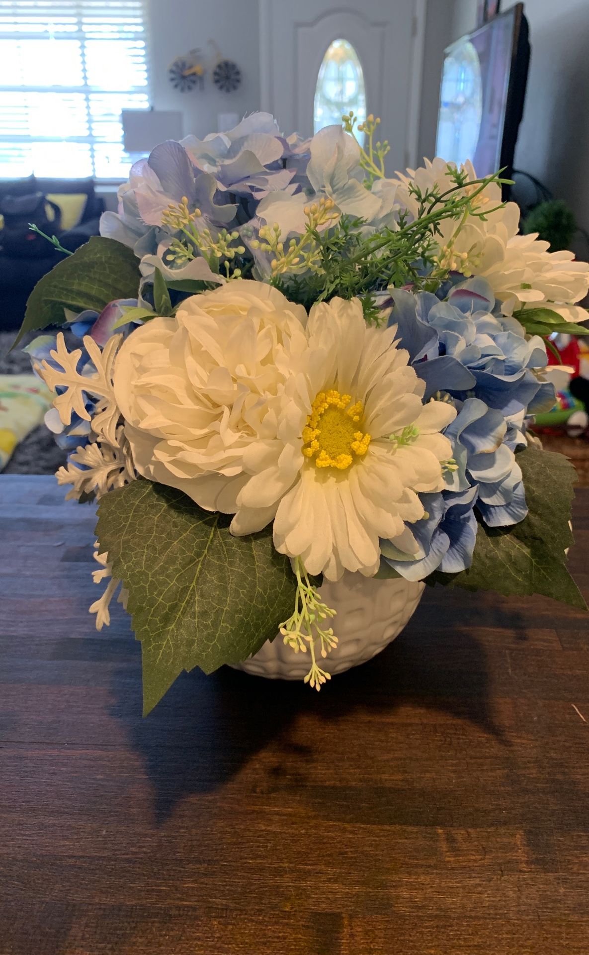 Silk baby blue and white flowers in white vase