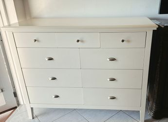 White wooden chest of drawers.