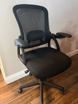 Ergonomic Mesh Back Office Chair featuring a breathable black mesh backrest and convenient flip-up armrests