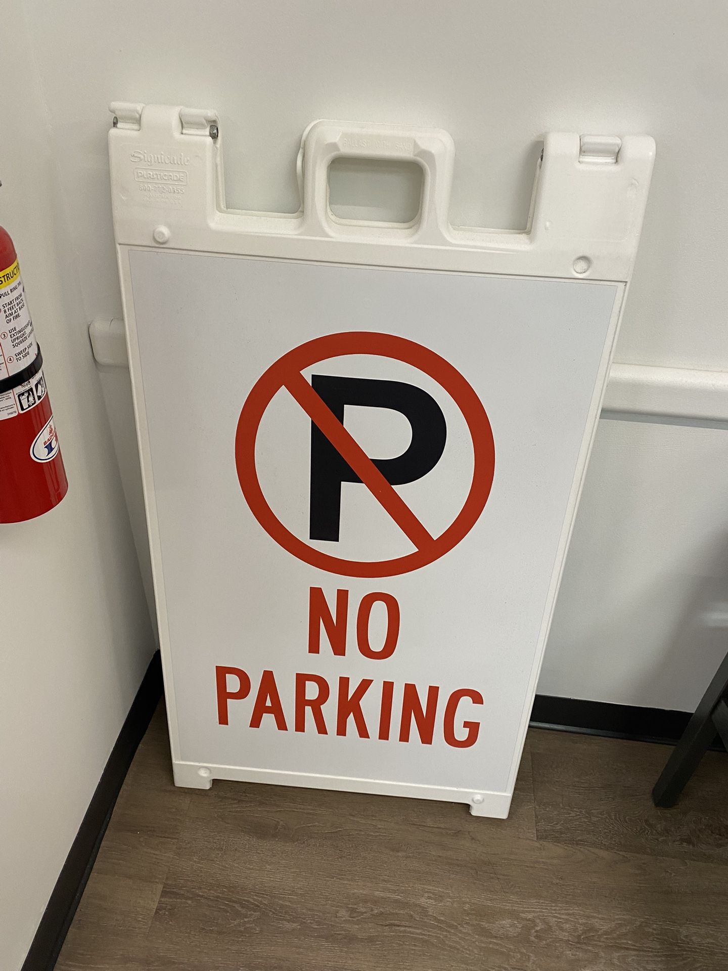 A Shape “No Parking” Sign