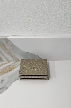 Set of 4 textured gold metal coasters