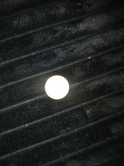 One dollar coin with no date and smooth edges