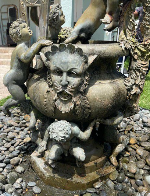 Bronze Fountain with cherubs playing around the fountain.