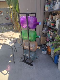 Black 4 water bottle stand with bottles