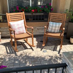 Two Wood Rocking Chairs.