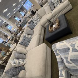 Ashley Crawford Sectional, huge cushions and pillows. Rug is included along with bean bag 
