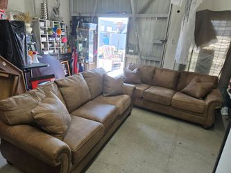 Ashley Brown Leather Sofa w/queen size Hide a bed