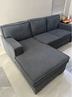 Small sectional with storage and converts to a bed