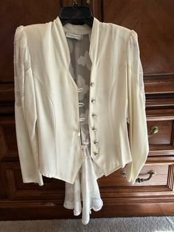 Cream colored top and skirt with lace up back
