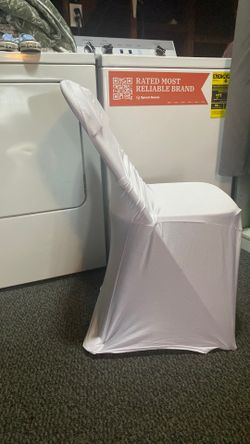 White chair covers and pink bows