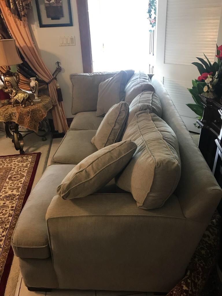 Feathered light grey sofa