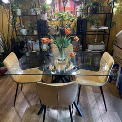 Tempered Glass Dining Table and Upholstered Side Chairs ( Black legs and yellow chairs)