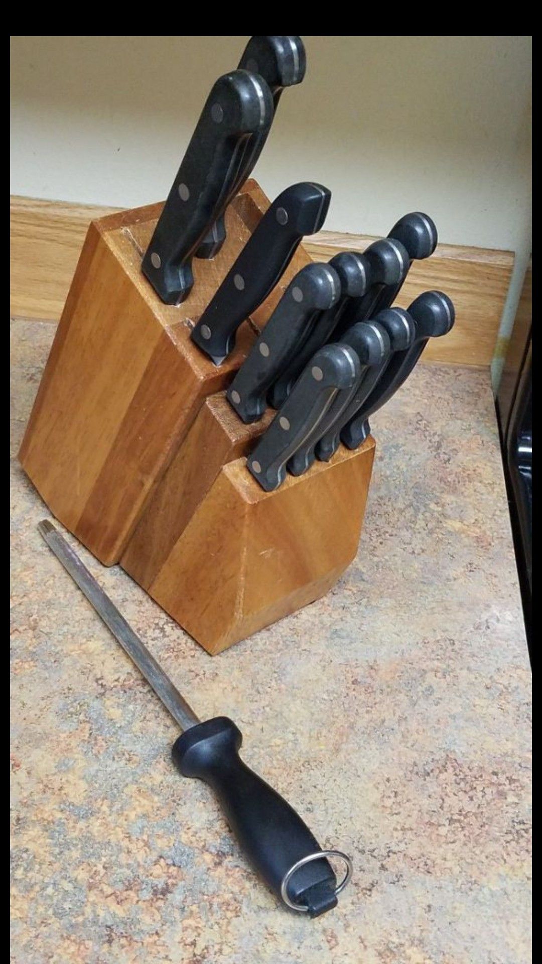 Good knife set with sharpener in a wooden block retail price $80 Barely Used