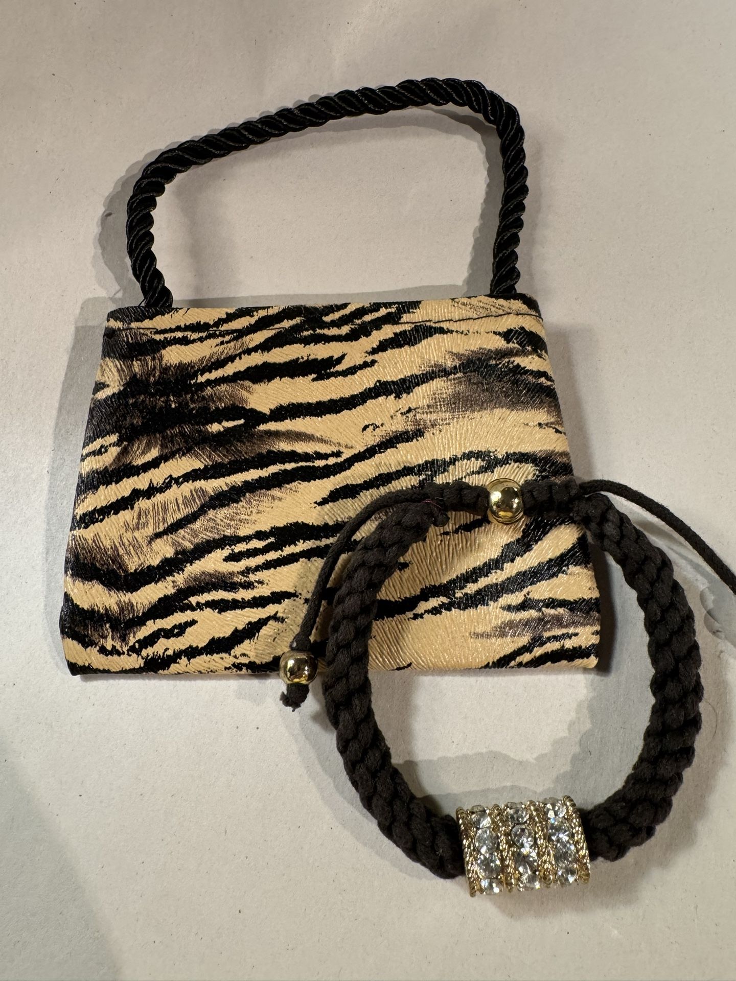 Brown braided bracelet with gold/clear rhinestone bar charm w/animal print pouch