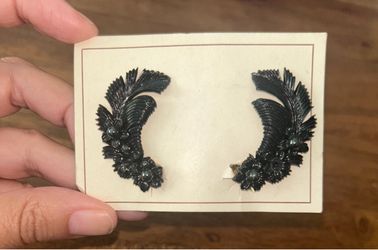 Vintage carved celluloid wing/floral clip on earrings.