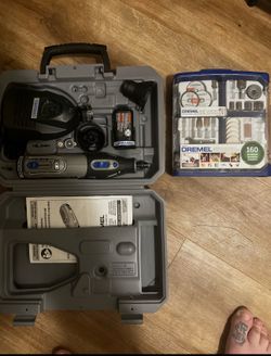 Dremel with charger battery and accessories but set