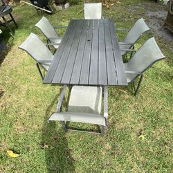 Used - Set of 7 pieces - Woodard Aluminum 84''W x 42''D Rectangular Dining Table With 6 chairs for $595