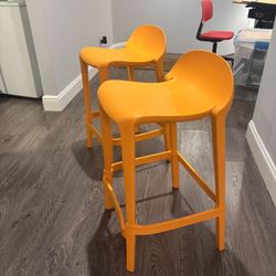 Two Orange bar Stools