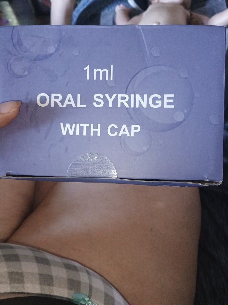 Oral syringes with caps intended for colostrum collection