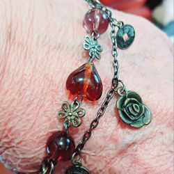 Adorable Glass Beaded Bracelet Adorned With Gold Tone Rose And Other Beautiful Charms